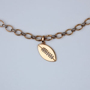 Sonoma Football Pendant in 22K Apricot Gold and 18K Alpine Gold Reinstein Ross Goldsmiths