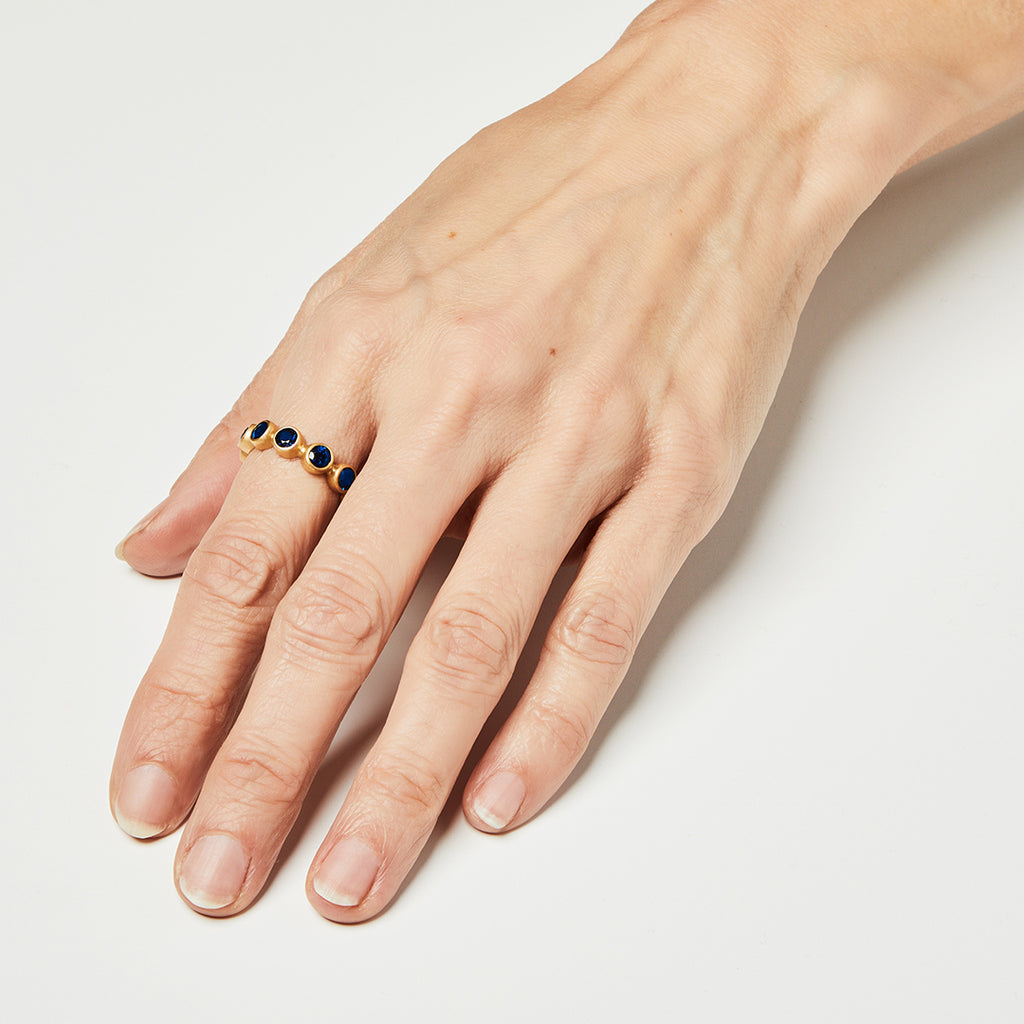 Renaissance Faceted Round Blue Sapphire Band in 20K Peach Gold